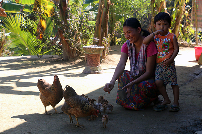 Madhumita Tanchangya now raises poultry, which helps supplement nutritional needs of her children and brings in extra income. Photo: UN Women/Jewel Chakma