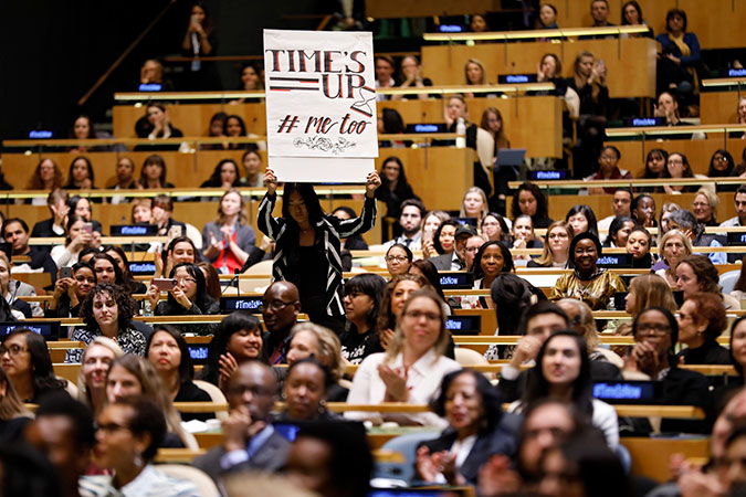 Women activists show their support for the #TimesUp and #MeToo movement at the commemoration of International Women's Day. Photo: UN Women/Ryan Brown