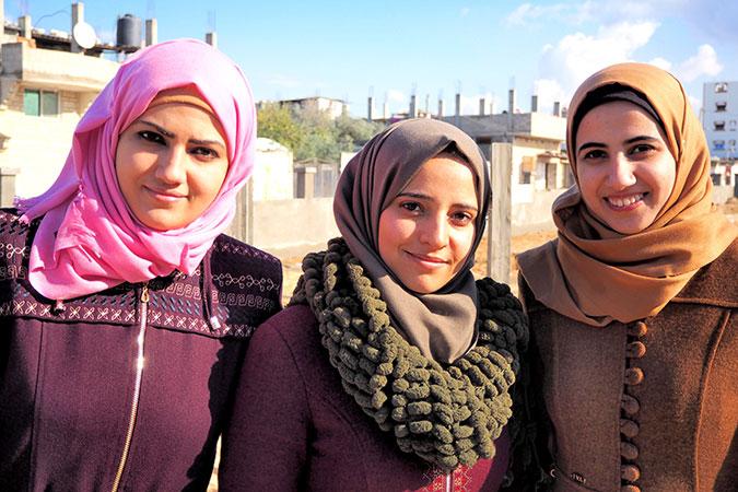 From left: Samah Al-Nahal, Dalia Osama and Nihal Zourob are three female architects who completed the blueprint of the public garden in Al-Shoka neighborhood in collaboration with the community members. Photo: UN Women/Eunjin Jeong