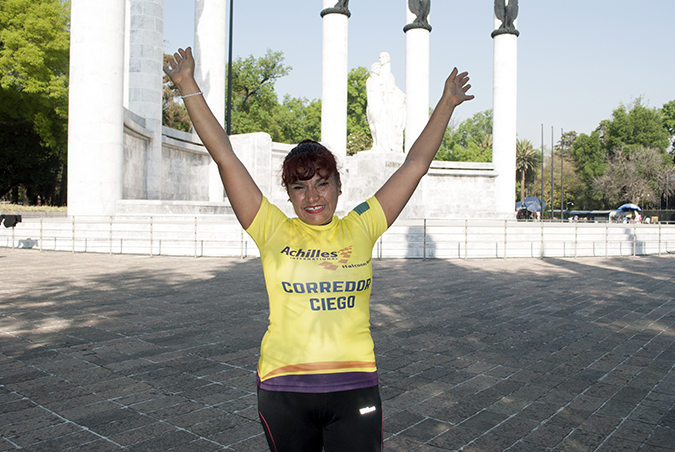 Palmira Martinez celebrates after completing the Carrera Bonafont con Causa 5k. Photo:  UN Women