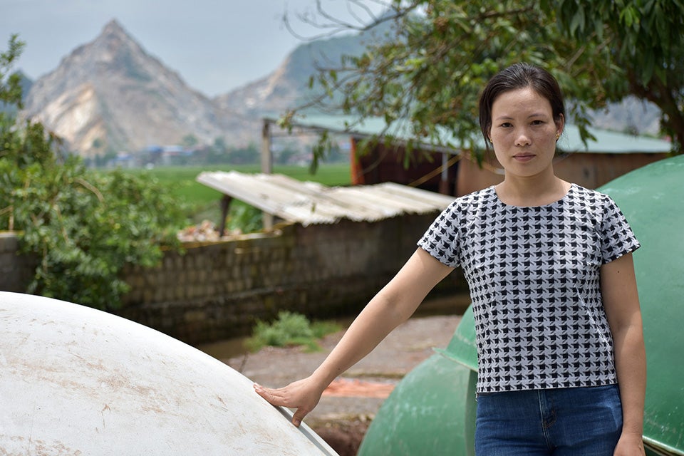 Trin Gim poses for a photo in  Ung Hoa District, South of Hanoi. Photo: UN Environment/Annette Wallgren