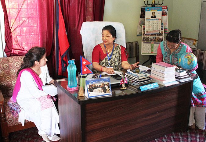 Ek Maya B.K., centre, Vice Chair of Khajura Rural Municipality in Banke, Nepal, meets with UN Women officials in her office on 28 June 2018 Photo: SABAH/Ayush Chaudhary