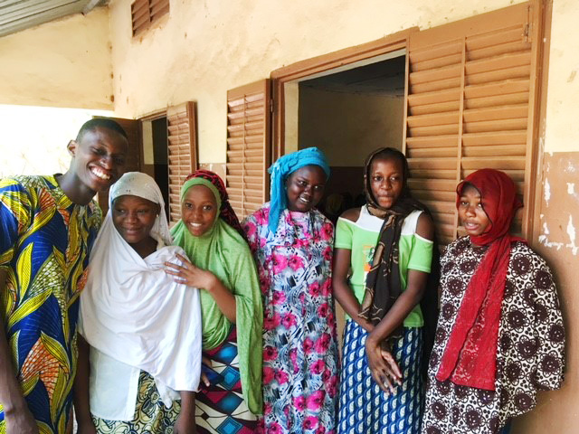 Fatouma, second from left, and some of her classmates in front of the school. Photo: UN Women/Sandra Kreutzer