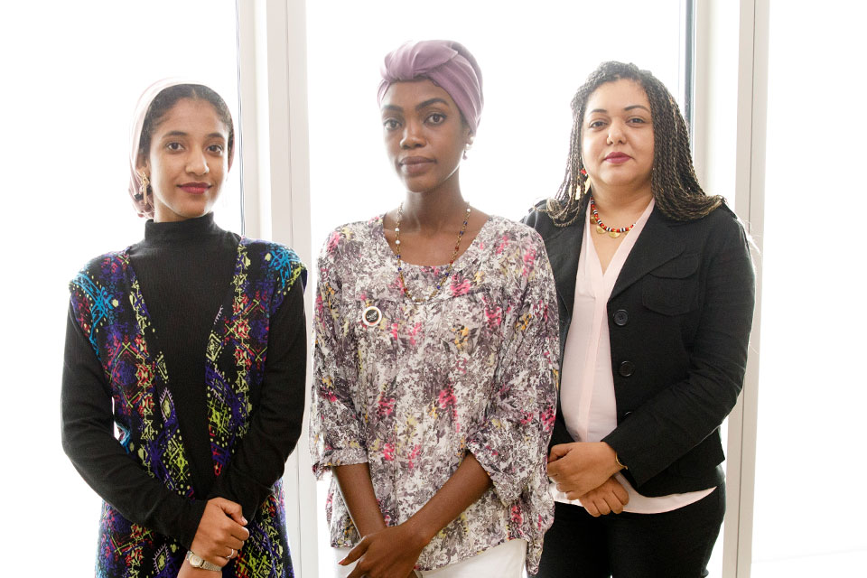 Aala Salah, Samah Jamous and Huda Ali pose for a photo at UN Headquarters in New York. Photo: UN Women/Ryan Brown