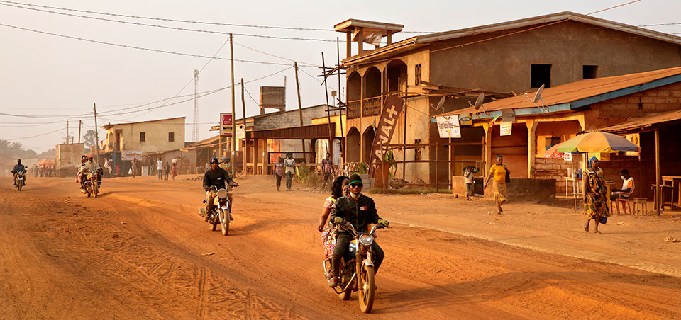 The Gender Road Project supports women-owned businesses, such as Mereng Bessela’s, located along the road running through Ntui, pictured above, a town of about 3000. Photo: UN Women/Ryan Brown