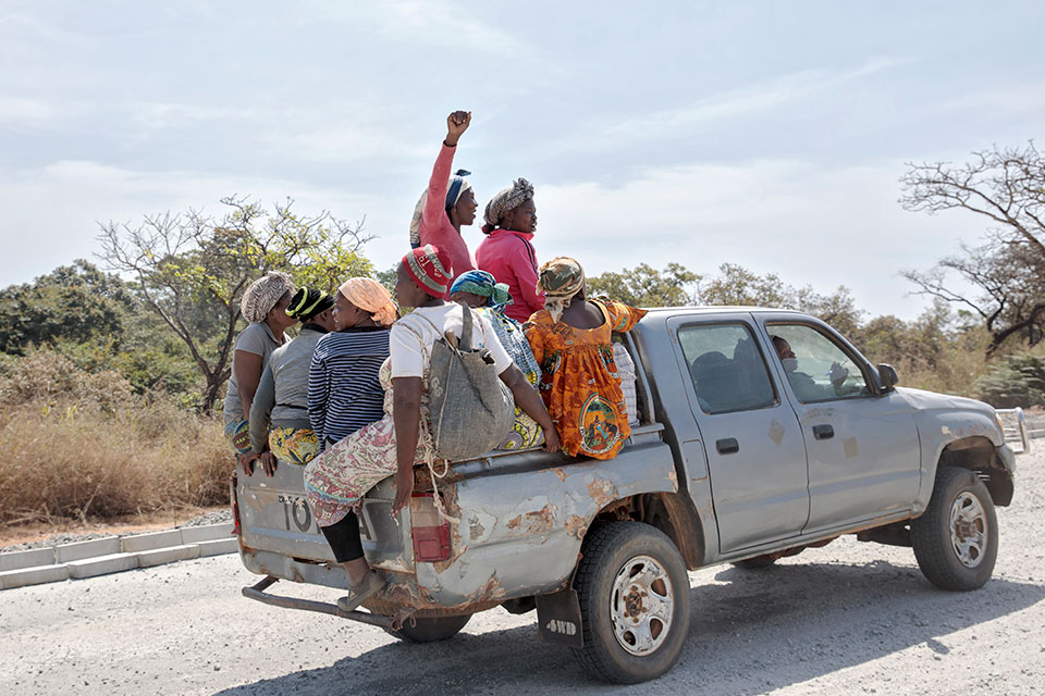 SOCCOMAD members share a ride back home. Photo: UN Women/Ryan Brown