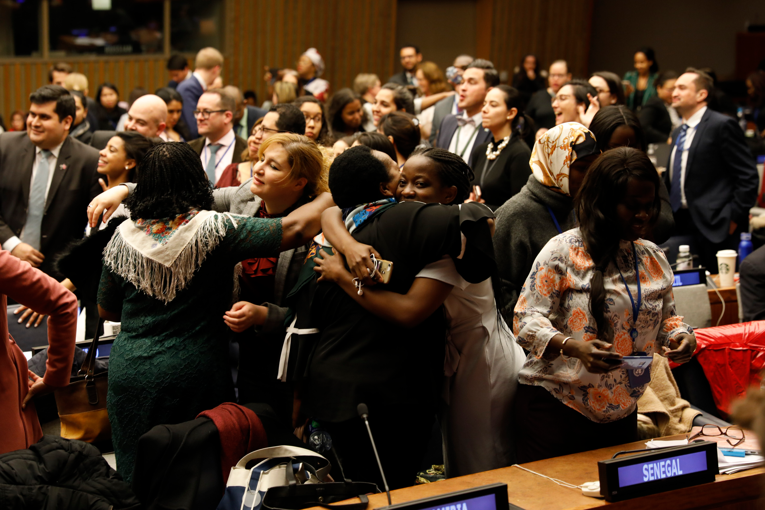 Participants rejoice as the 63rd session of the UN Commission on the Status of Women adopts Agreed Conclusions that delivers road map on ensuring women’s social protection, mobility, safety, and access to economic opportunities. Photo: UN Women/Ryan Brown