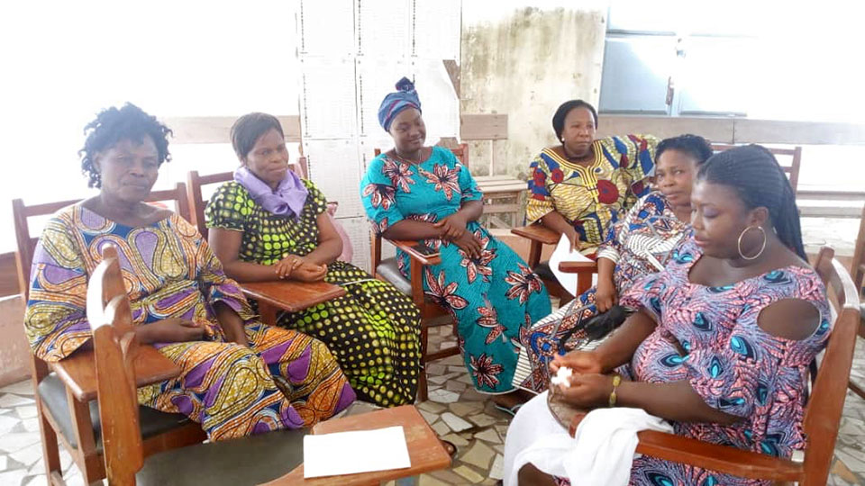 A  group of women in Benin meet with two trained psychosocial support service providers. Photo: IFMA/Nassirine Ariori
