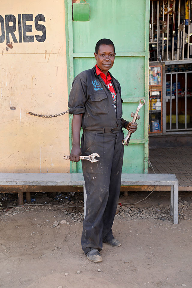 Christine Wambulwa is the sole breadwinner of her family. She puts her children through school by working as the sole female mechanic in Kakuma. Photo: UN Women/Ryan Brown