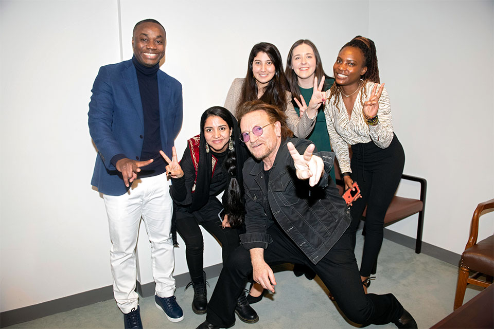 Singer and co-founder of the ONE campaign, Bono, poses for a photo with youth leaders and activists. Photo: Mission of Ireland/Kim Haughton