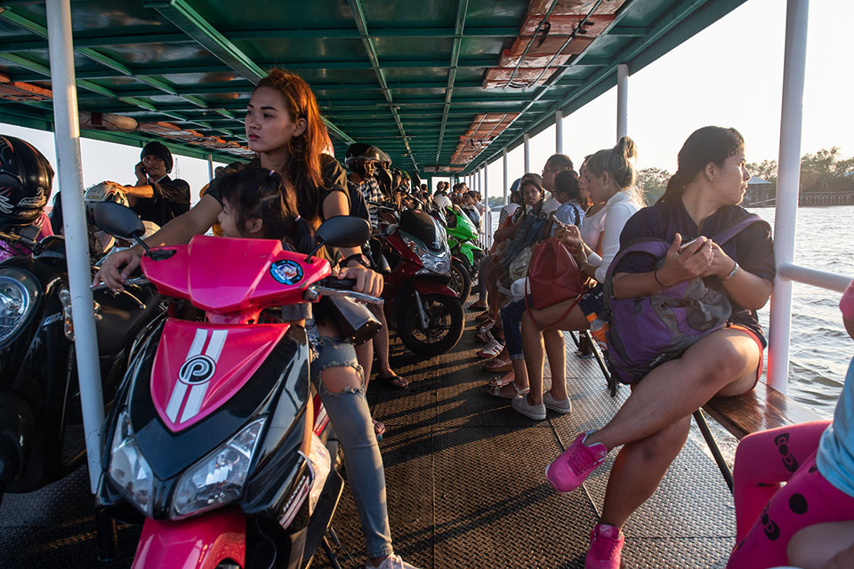 A woman and young child commuting via ferry, Thailand. Photo: UN Women/Pathumporn Thongking