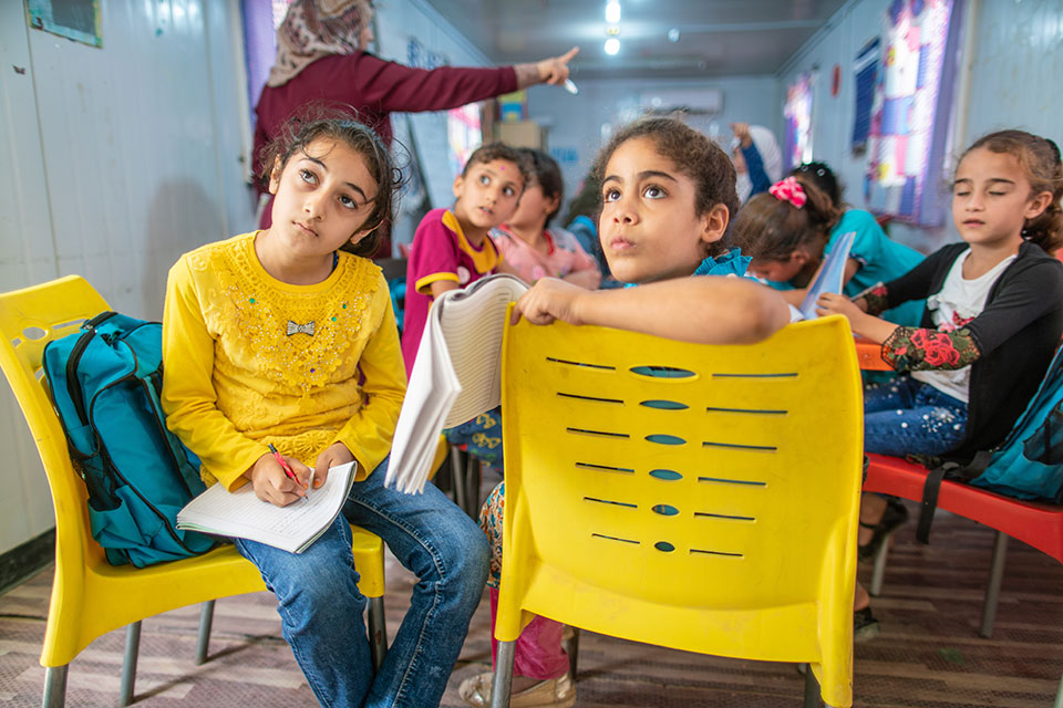 Students concentrate during their remedial education classes at the ‘Oasis Center for Resilience and Empowerment of Women and Girls’ operated by UN Women in the Za’atari refugee camp in Jordan. Photo: UN Women/Christopher Herwig