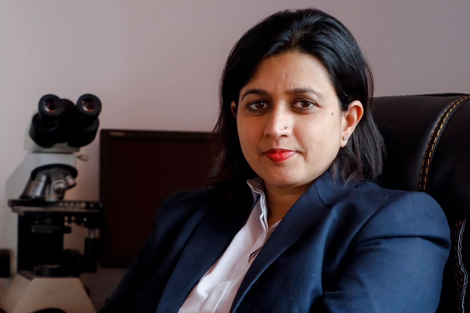 Dr. Runa Jha poses for a photo in her office. Photo courtesy  of Dr. Runa Jha. 