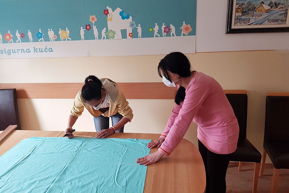 Current and former beneficiaries of women's shelter in Sombor, Serbia, got together to use their skills to contribute to COVID-19 response in their local community. They are sewing protective masks for taxi drivers driving healthcare workers and representatives of different local public utility companies. Credit: UN Women/Tamara Savovic