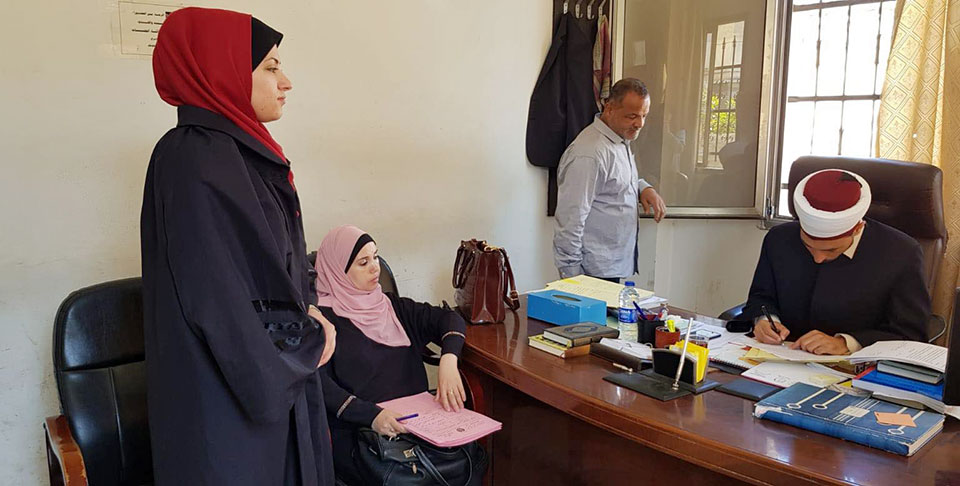PCHR trainee lawyer Haya Al Wehaidi filing a request for her client to be granted   custody of her minor children at a Sharia court in Gaza Photo: PCHR 