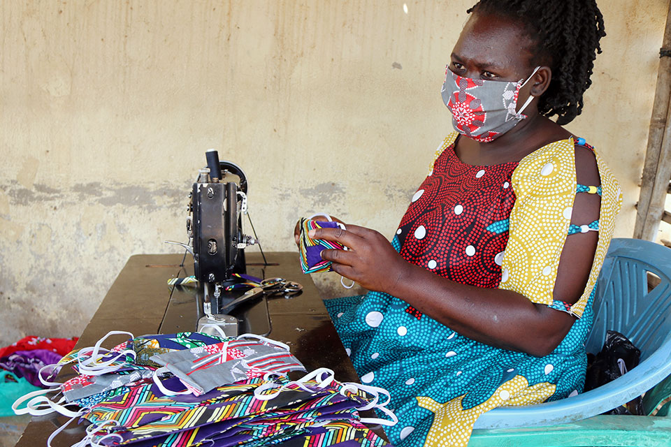 UN Women is currently supporting 52 women’s tailoring groups to produce and sell face masks. Photo: UN Women/ Estella Turukoyo John