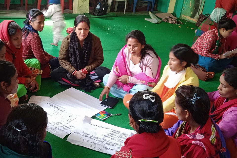 Laxmi Badi, center in pink shawl, participating in a group work during Feminist Leadership training. Photo: Nepal National Dalit Social Welfare Organization/Shanker Biswokarma