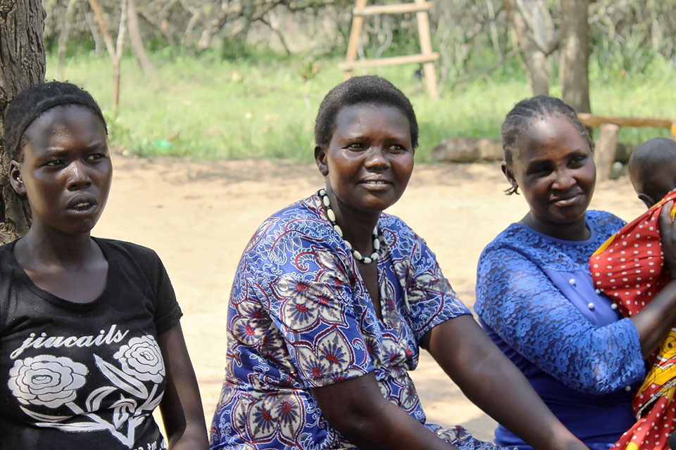 Rebecca Chepkateke (centre) sits with women from Ashiokanian village. Photo: NAWOU/Fionah Barbra