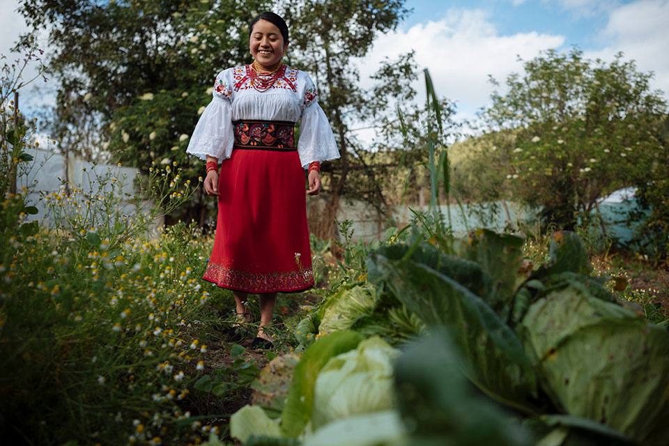 Belen Perugachi strolls through her family’s garden. Photo: UNICEF/Santiago Arcos