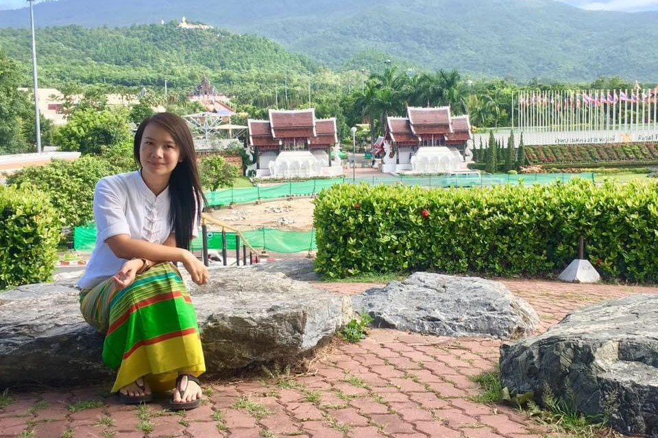 San May Khine, in a traditional Shan dress, in front of Royal Park Rajapruek in Chiang Mai, Thailand after hosting a programme on the rights of the child and women. Photo courtesy of San May Khine