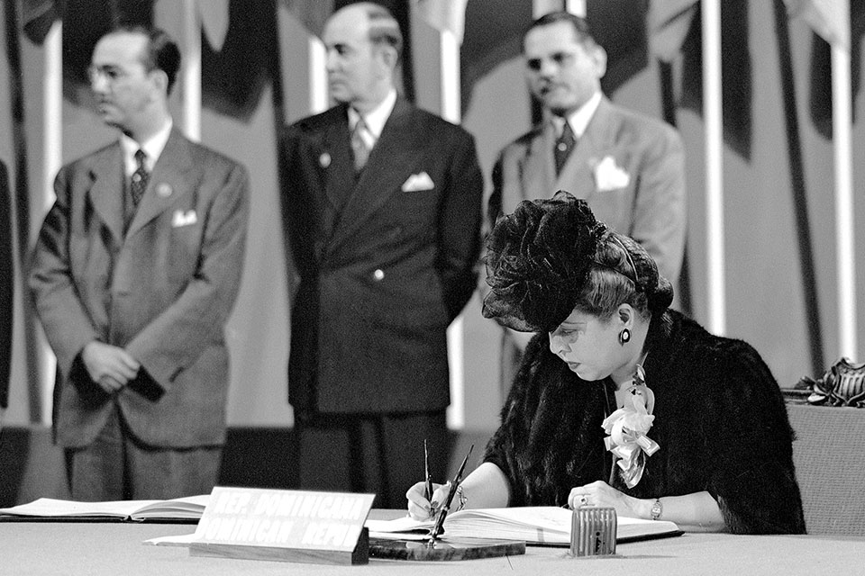 Minerva Bernardino, President, Inter-American Commission of Women, member of the Delegation from the Dominican Republic, signing the United Nations Charter at a ceremony held at the Veterans' War Memorial Building in San Francisco, California on 26 June 1945. Photo: UN Photo