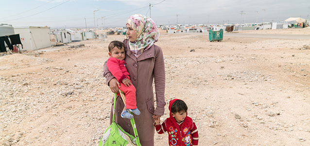 A refugee woman with her children in Zaatari Refugee camp in Jordan. Photo: UN Women/Christopher Herwig