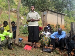 At a co-op meeting women explain how their lives have improved after becoming members. They can pay for their children's educations and medical insurances, and fear less of falling ill. (Photo Credit: UN Women/Ana Lukatela)