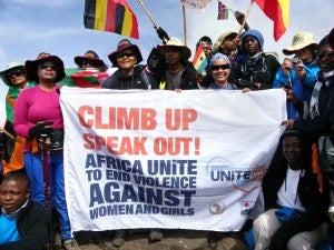 Climbers raise their flags to celebrate milestones as they make their way up Mount Kilimanjaro. (UN Women Photo) Climbers raise their flags to celebrate milestones as they make their way up Mount Kilimanjaro. (UN Women Photo)