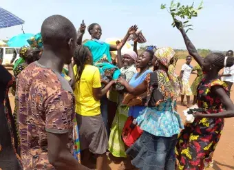 Women of Bidibidi Refugee Settlement celebrate a win in the RWC elections held in February 2022. Photo: UN Women/Athanasius Oguti