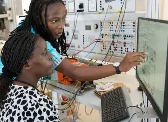 Students in the renewable energy lab at the University of Rwanda. Digital inclusion and literacy skills are critical factors for women’s and girls’ well-being and success. Photo: World Bank/Kelley Lynch