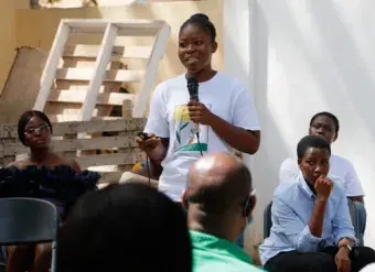 A participant of the Envisioning Resilience initiative in Ghana tells the story behind a photo she captured showing the impacts of climate change on her life. Photo: Dennis Nipah