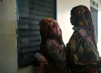 On 2 May 2023 people wait for treatment at Fashir Reproductive health centre. The centre received WASH and health supplies from UNICEF. 