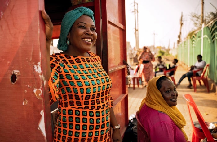 Gender specialist Hawa Games Dahab Gabjenda stands in a doorway.