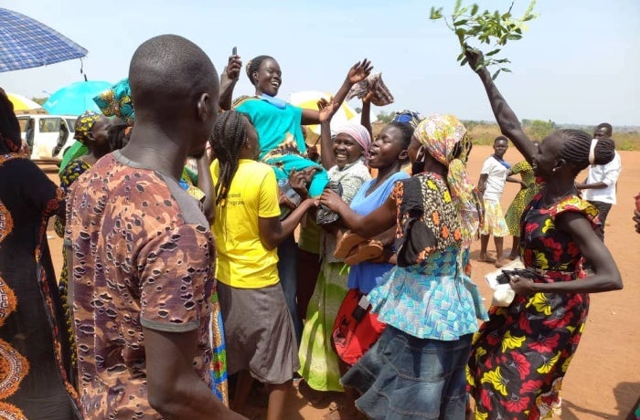 Women of Bidibidi Refugee Settlement celebrate a win in the RWC elections held in February 2022. Photo: UN Women/Athanasius Oguti