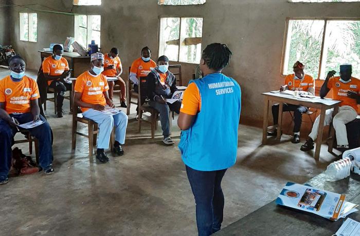 A facilitator from Cameroon’s United Youths Organization leads a HeForShe dialogue with men in the municipality of Batibo. Participants wear shirts with the hashtag #TogetherAgainstGBV. Photo: United Youths Organization.