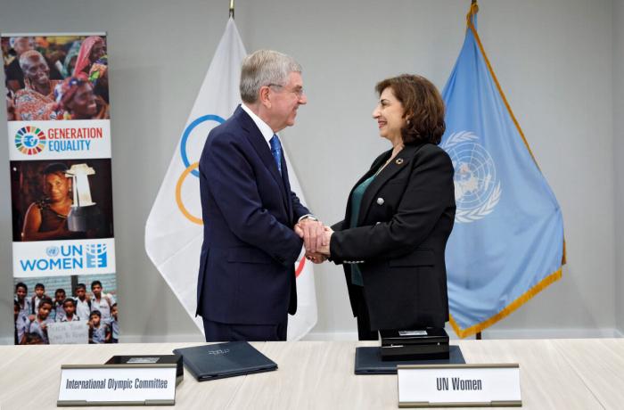 UN Women Executive Director Sima Bahous shakes hands with President of the International Olympic Committee Thomas Bach following the signing of a memorandum of understanding between the two organizations on 18 September 2023 at UN Women Headquarters in New York. Photo: UN Women/Ryan Brown.