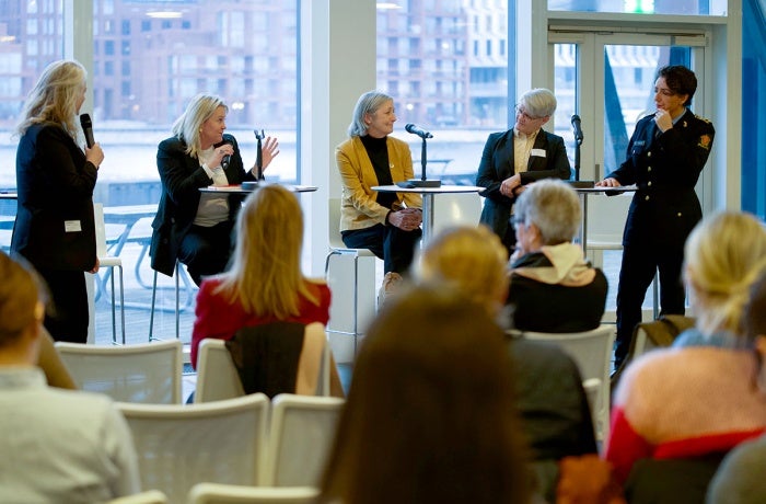 Speakers, including UN Women Senior Police Consultant Jane Townsley (third from left), discuss best practices for gender-responsive policing at a conference in Copenhagen. 