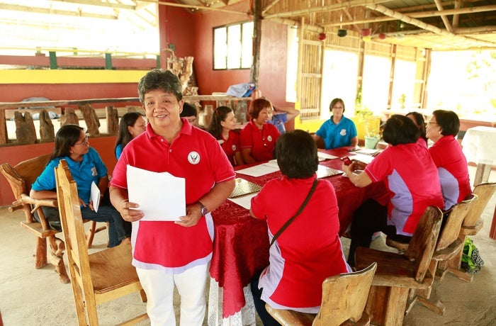 Edna Valdez, President of Bannuar TI La Union, an organization that advocates for and supports women migrant workers, is seen in 2016 in La Union province, Philippines.