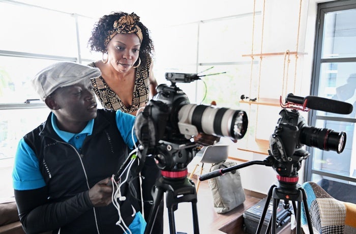 Adelle Onyango (in brown) interacts with a guest during a shoot for her Legally Clueless podcast in Nairobi. 