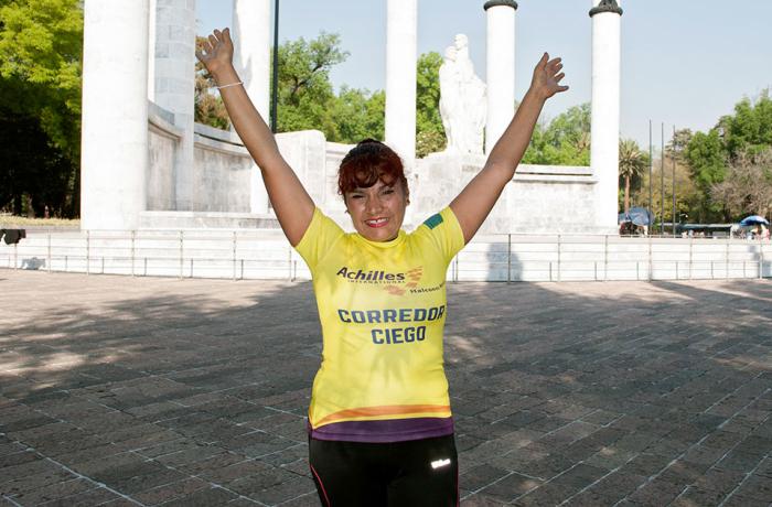Palmira Martínez celebrates after participating in the Carrera Bonafont con Causa 5 kilometre race. Photo: UN Women
