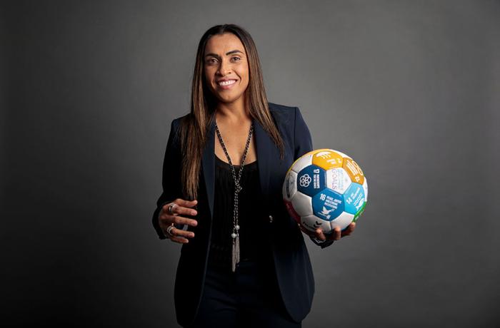 Marta Vieira da Silva holds a soccer ball with the global goals on it, at UN Women headquarters in New York. Photo: UN Women/Ryan Brown
