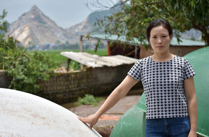 Trin Gim poses for a photo in  Ung Hoa District, South of Hanoi. Photo: UN Environment/Annette Wallgren