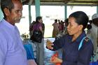 Sergeant Amelia de Jesus Amaral, a police officer in rural Timor-Leste, explains to customary leader Norberto Tomas why it is important to report every single case of domestic violence.