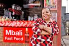 Mbali Luvuno learned to successfully manage her business after skills training provided by the 5by20 programme. Photo: The Coca-Cola Company