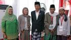 Indonesian President Joko Widodo (centre) with UN Women and partners. Photo: UN Women/Ryan Brown