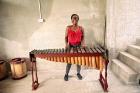 Mila Rodriguez plays the marimba, an instrument used in traditional Afro-Colombian music. Photo: UN Women/Ryan Brown