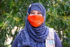 Minara poses for a photo, wearing her protective face mask. Photo: UN Women/Mahmudul Karim