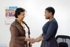 UN Women Representative in Tanzania Hodan Addou shakes hands with youth advocate Gertrude Mligo.   Photo: UN Women/Tsitsi Matope